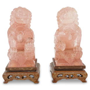 Pair Of Chinese Rose Quartz Foo Dogs: DESCRIPTION: Two matching rose quartz foo dogs (guardian lions): one male with an embroidered ball beneath his right fore paw, one female with a subdued cub beneath her left fore paw. Pieces are each