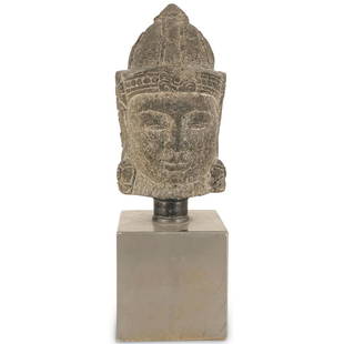 Chinese Carved Stone Temple Buddha Head: DESCRIPTION: An antique carved stone temple Buddha head atop a square metal display base. CIRCA: 18th Cent. ORIGIN: Asia DIMENSIONS: (Overall) H: 25" x D: 9" (Head) H: 14.5" x D: 9" CONDITION: