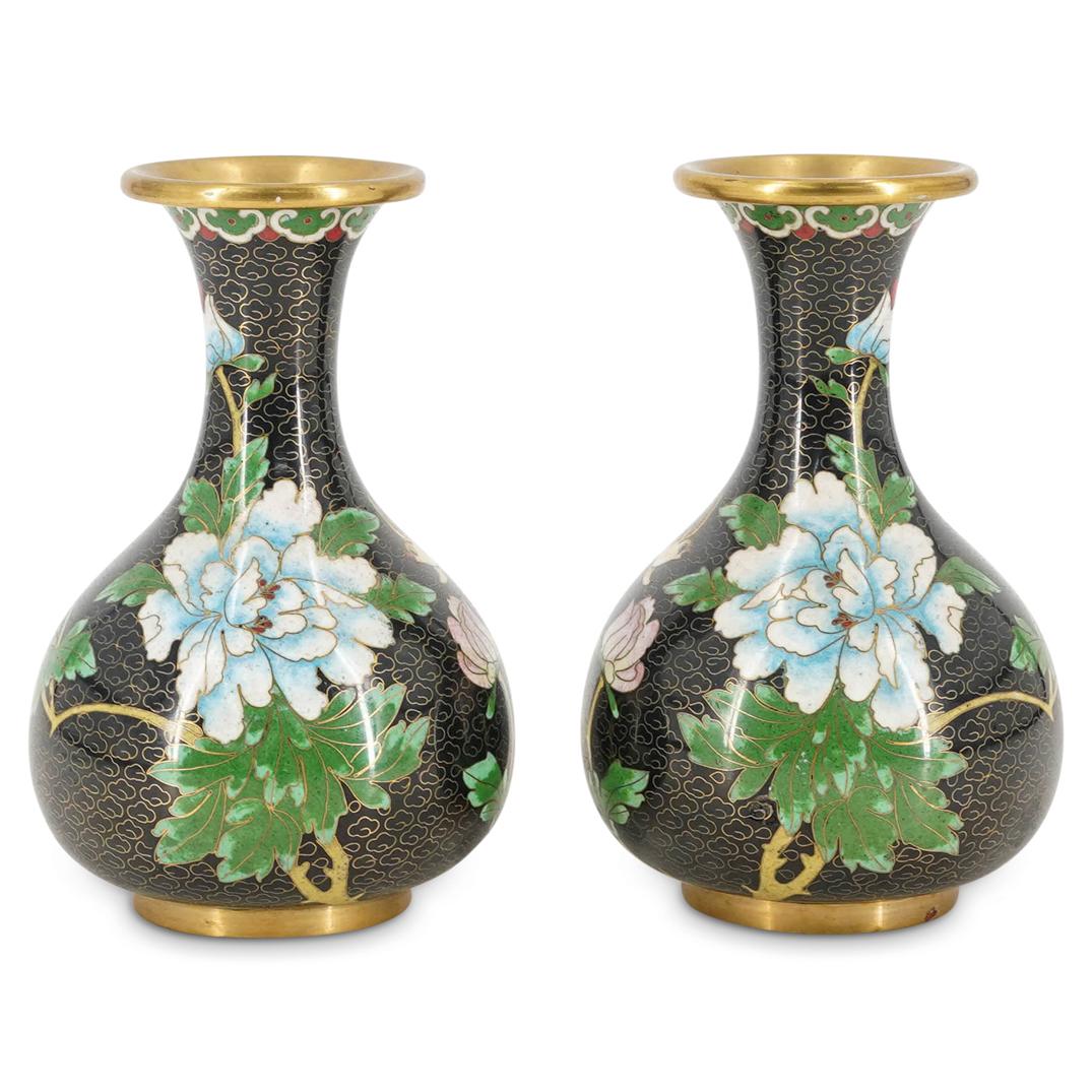 Pair Of Chinese Cloisonne Noir Vases: DESCRIPTION: Two mirrored cloisonne noir vases each featuring a bulbous body and a flared lip. Each is decorated with floral, bird, and foliage motifs against a cloud pattern background. CIRCA: 1940s-