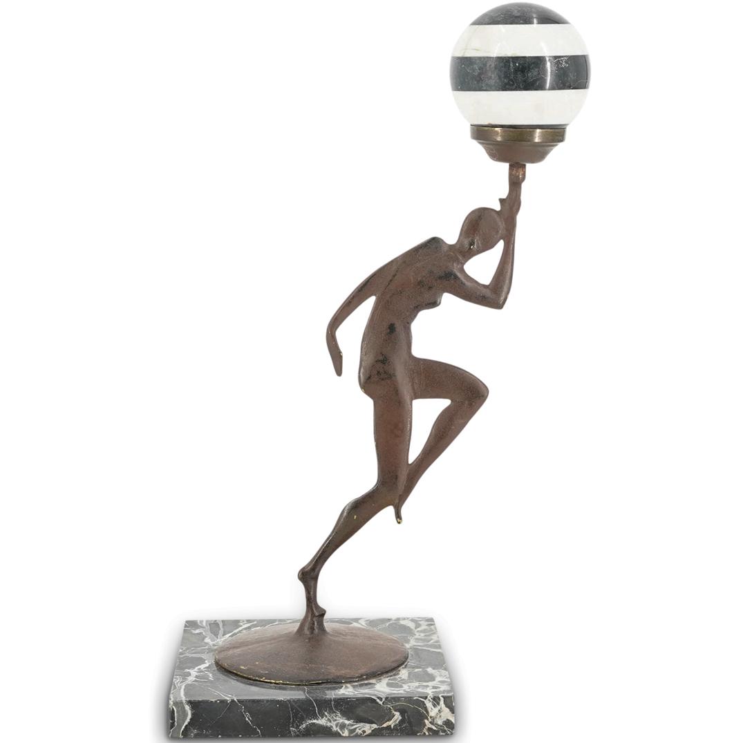 Art Deco Style Bronze & Marble Sculpture: DESCRIPTION: An Art Deco style bronze sculpture depicting a female nude figure in a dancing pose, and holding a globe made of striped white and black marble. The sculpture stands atop a square variega