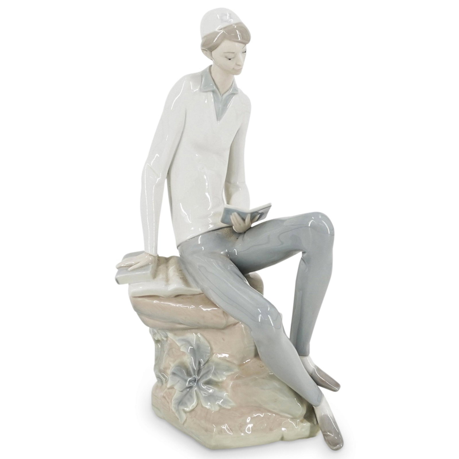 Lladro "Jewish Boy Reading Book" Porcelain Figurine: DESCRIPTION: A Lladro glazed porcelain figurine depicting a hebrew boy in a seating position, reading a book. This is the "Jewish Boy Reading a Book" porcelain figurine. Model number # 4684. Marked wi