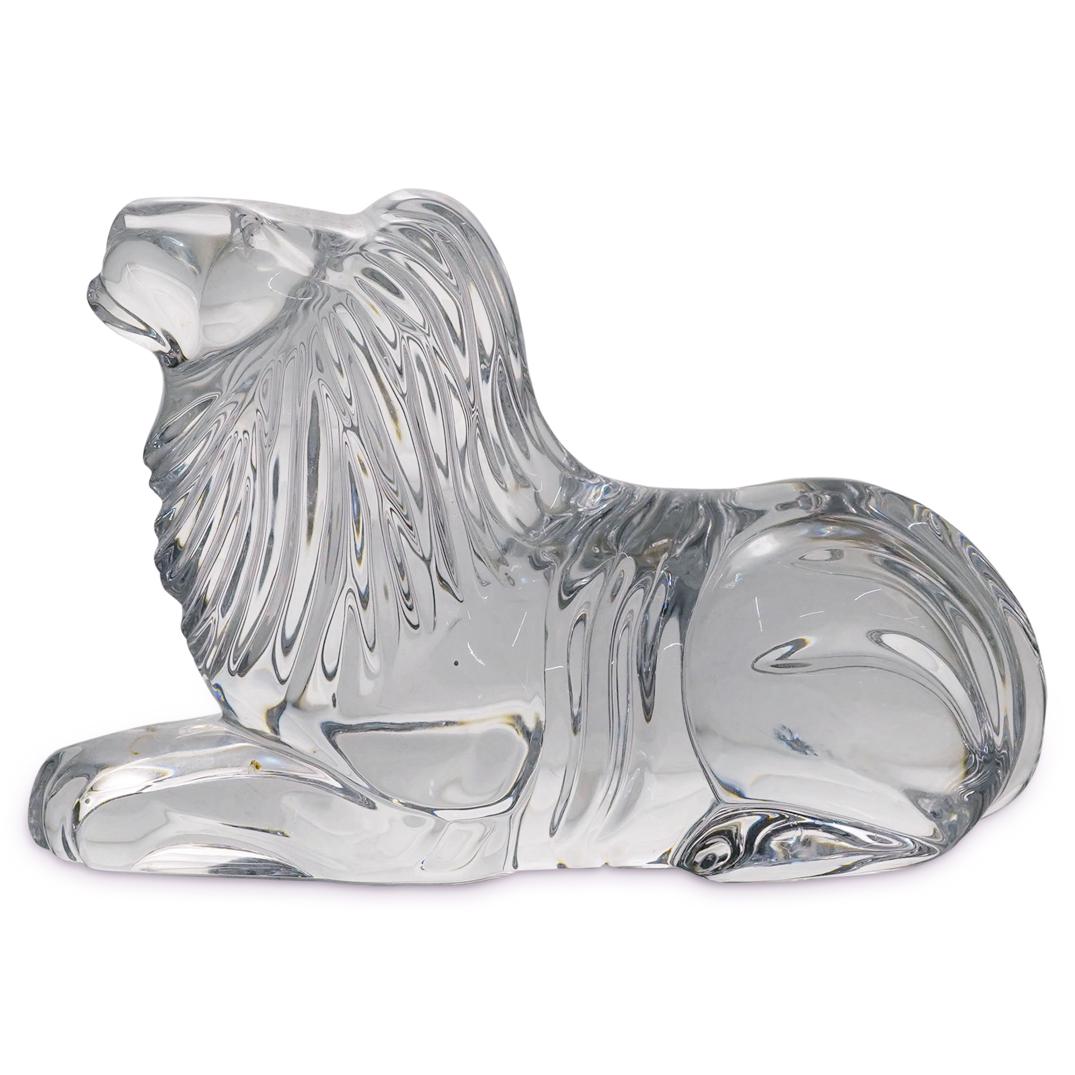 Waterford Crystal Lion Sculpture: DESCRIPTION: Waterford crystal lion sculpture with modern details around its mane and tail. Etched at the backside "Waterford" CIRCA: 20th Century ORIGIN: Ireland DIMENSIONS: H: 4.5" X W: 2.5" X L: 7"