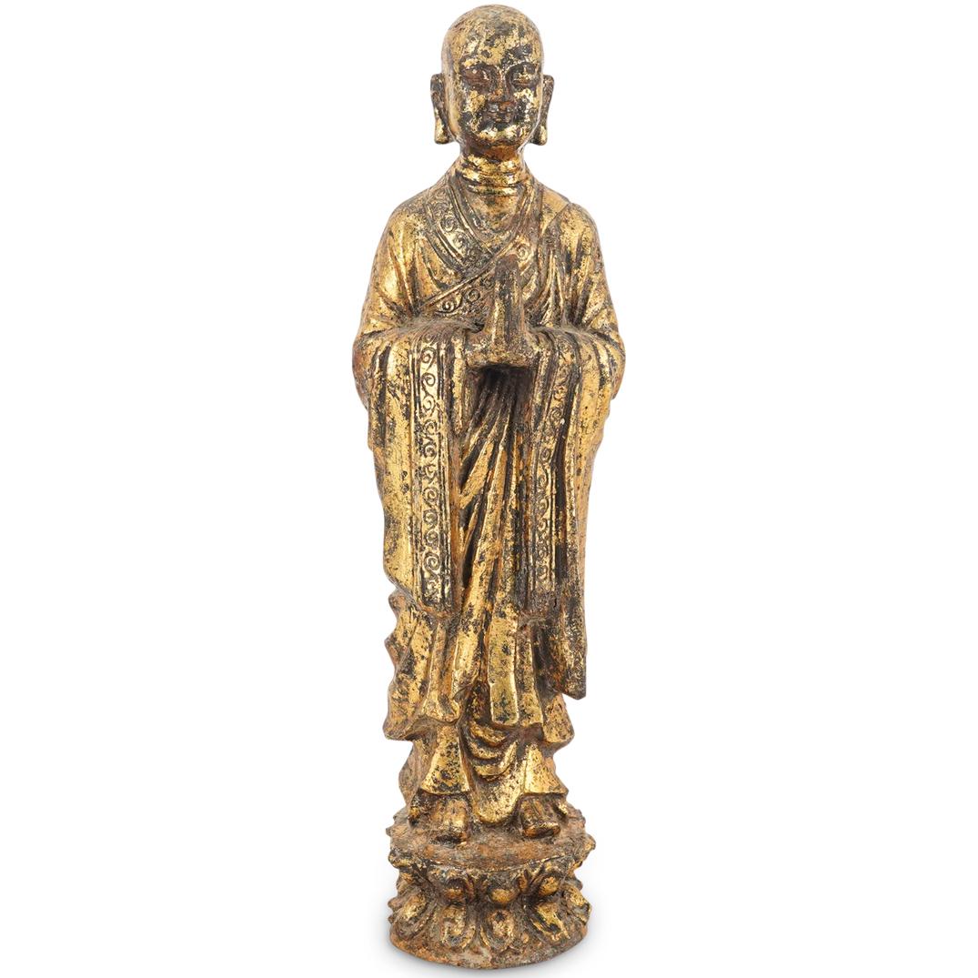 Chinese Gilt Metal Arhat Sculpture: DESCRIPTION: Gilt metal sculpture of an arhat (Buddhist disciple) standing on a lotus with hands in the veneration gesture. CIRCA: 20th Century ORIGIN: China DIMENSIONS: H: 18.75" W: 4.25" L: 5.25" Ha