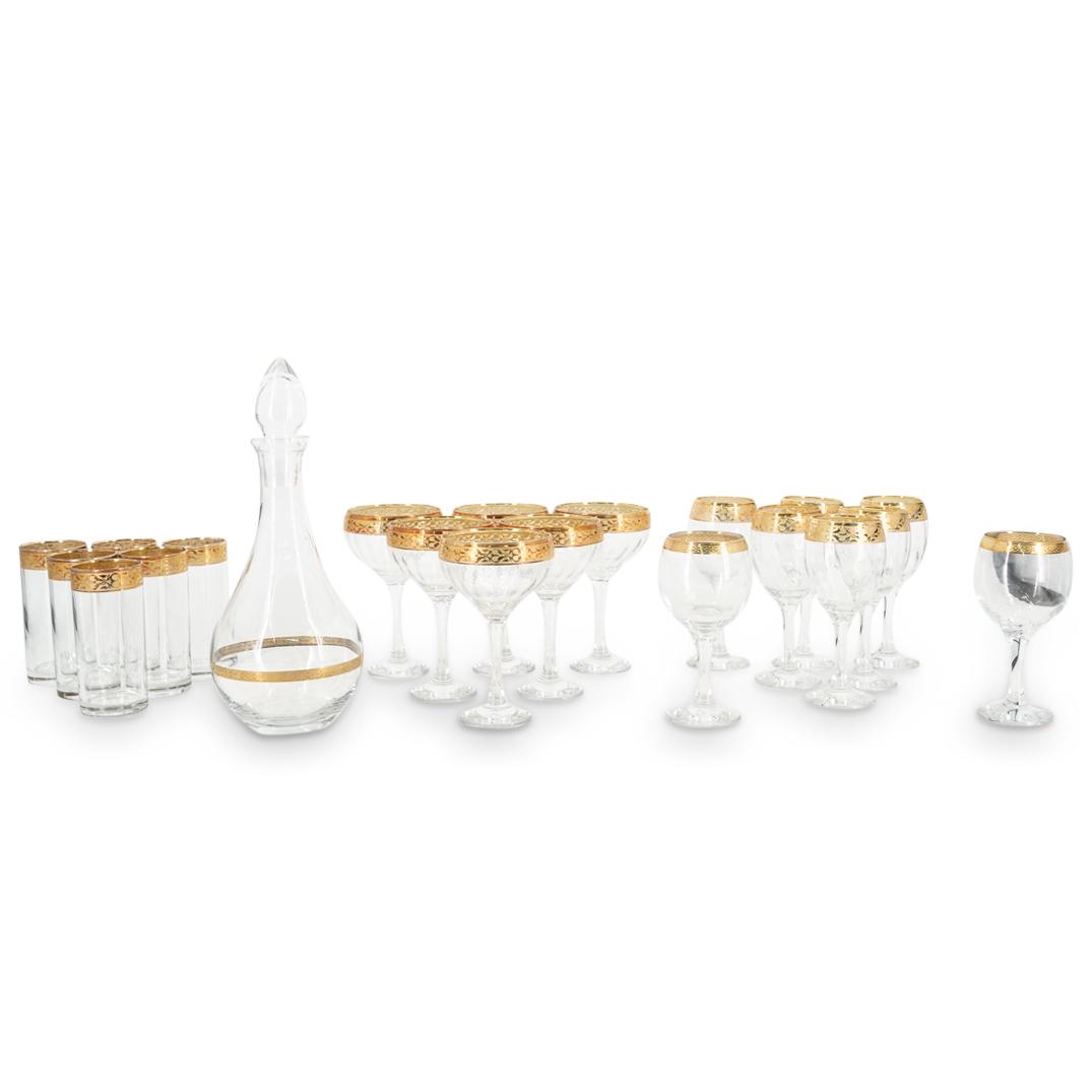 (21Pc) Italian Parcel Gilt Crystal Stemware set: DESCRIPTION: (21Pc) Italian crystal stemware set with ornate etched gilt floral design. (1) Decanter. (H: 12.25" X D: 5.25") (6) Cocktail glasses. (H: 6.5" X D: 3.87") (6) Wine glasses. (H: 6.75" X D: