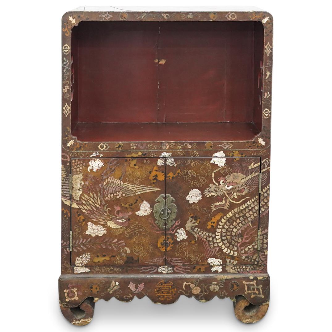 Joseon Dynasty Korean Lacquer And Sharkskin Cabinet: DESCRIPTION: Leather upholstered wooden antique cabinet box featuring a shelf flanked by open-work wan ci ("swastika") carved into the sides and a two-door lower shelf. Decorated with matching sharksk