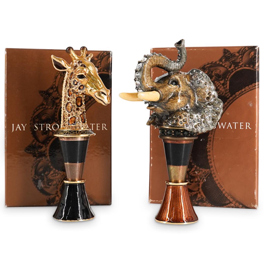 (2Pc) Jay Strongwater Hand Signed Elephant & Giraffe Wine Stoppers: DESCRIPTION: Jay Strongwater hand signed enamel elephant and giraffe wine stoppers with original boxes and certificate of authentications. CIRCA: 21st Cent. ORIGIN: USA DIMENSIONS: (Elephant Stopper) 