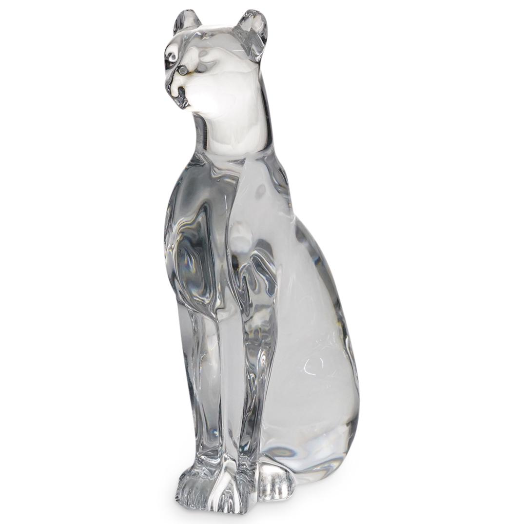 Baccarat Crystal Panther: DESCRIPTION: Baccarat crystal sculpture of a seated panther with its tail wrapped around its right side. Marked on underside with Baccarat hallmark. CIRCA: 20th Century ORIGIN: France DIMENSIONS: H: 6