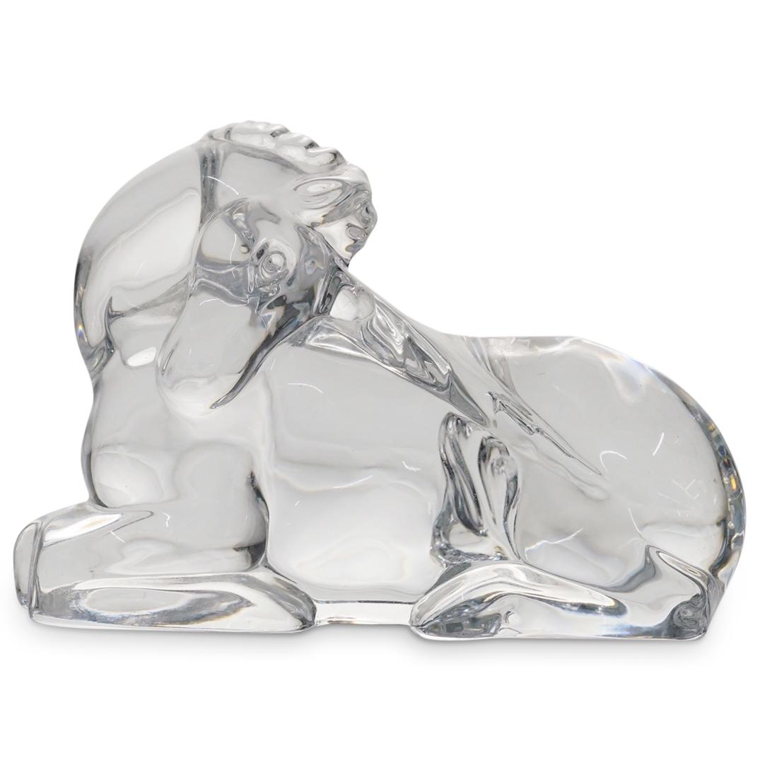 Baccarat Crystal Unicorn: DESCRIPTION: Baccarat crystal sculpture of a unicorn at rest and pointing its horn at its hind quarters. Marked on underside with Baccarat hallmark. CIRCA: 20th Century ORIGIN: France DIMENSIONS: H: 3