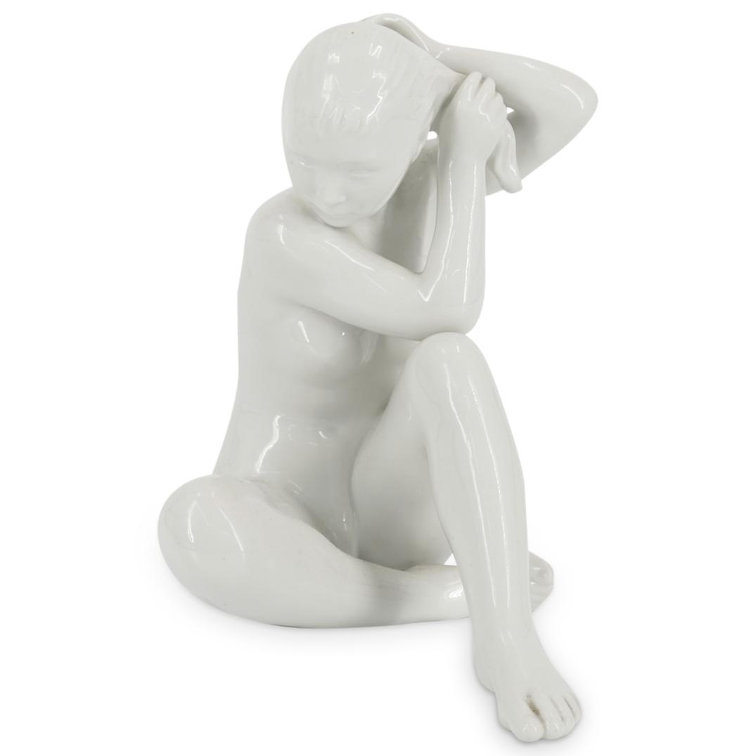 Bing & Grondahl Nude Woman Porcelain Sculpture: DESCRIPTION: Bing and Grondahl porcelain sculpture of a nude seated woman rinsing her hair. Marked at the underside "Kjo Benhavn Denmark 2280 B&G". CIRCA: 20th Century ORIGIN: Denmark DIMENSIONS: H: 9