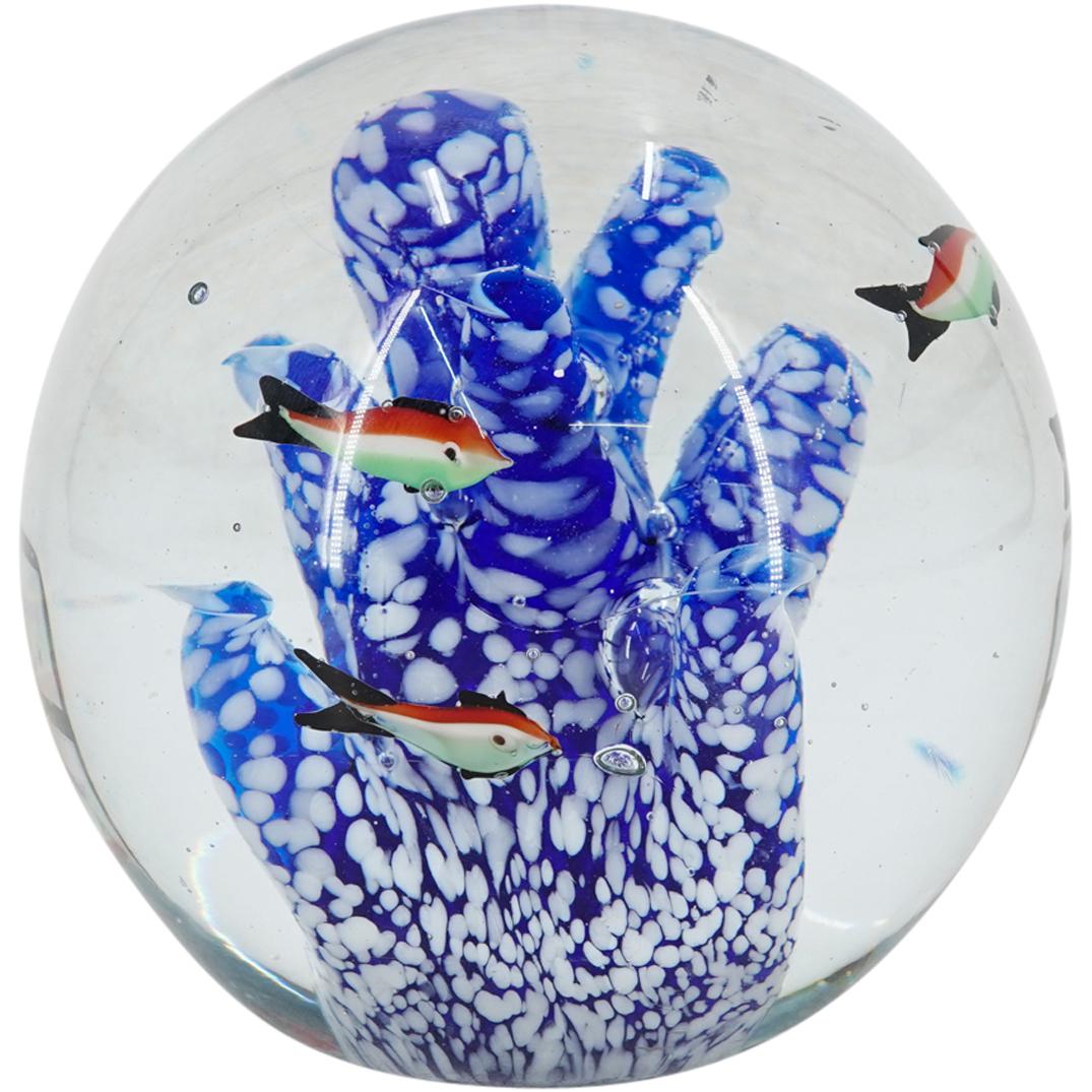 Murano Glass Fishbowl Orb Paperweight: DESCRIPTION: Murano glass orb paperweight with depictions of red, white and green striped fish swimming inside around a white spotted blue organic form. CIRCA: 20th Century ORIGIN: Italy DIMENSIONS: H