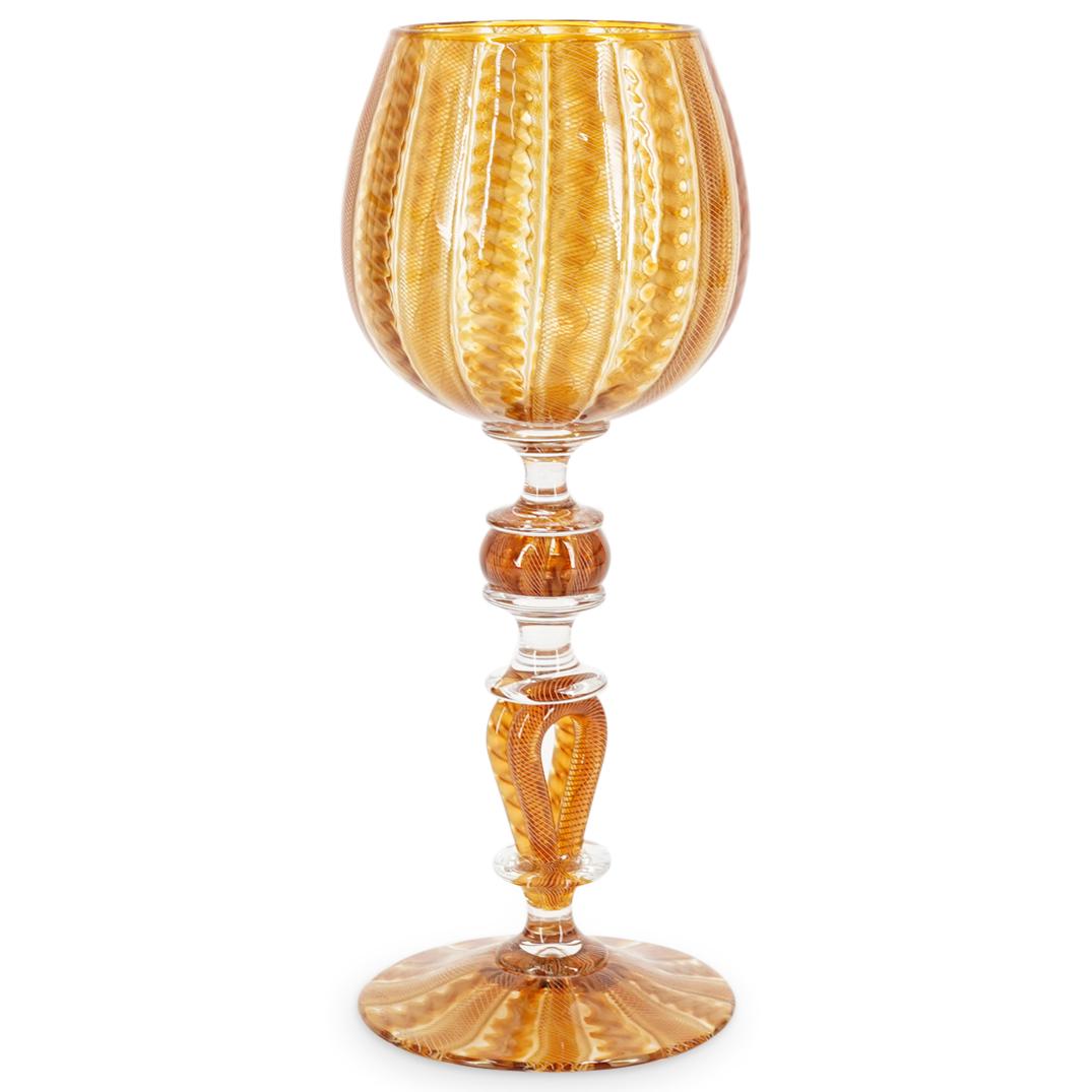Signed Italian Vintage Swirl Glass Goblet: DESCRIPTION: Vintage goblet featuring two types of swirl designs throughout. Decorated with a stem composed of two loops, a sphere, and three plinths. Finished with a disc-shaped foot. Signed on foot 