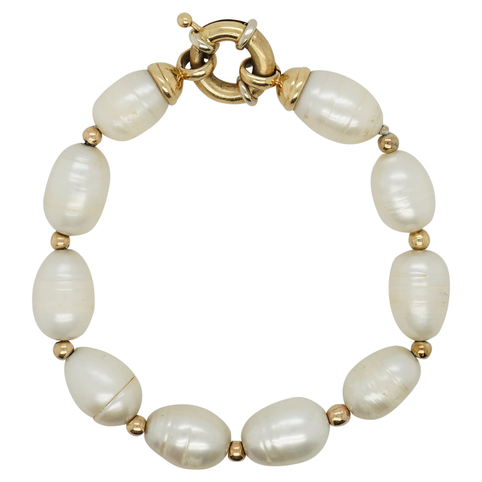 18k Gold and Pearl Bracelet: DESCRIPTION: A beaded pearl bracelet features oval shaped beads with 18k yellow gold fittings and completed with a lobster clasp. Total Weight: 13 dwt CIRCA: Mid 20th Cent. ORIGIN: France DIMENSIONS: 