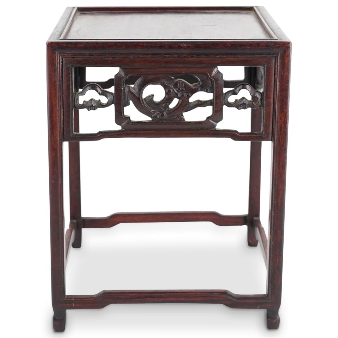 Antique Chinese Carved Wood Dragon Stand: DESCRIPTION: Antique Chinese carved lacquered wood stand comprised of beveled legs terminating in hoof feet, humpback stretchers and open work depictions of dragons in smoke at each side. CIRCA: 19th 