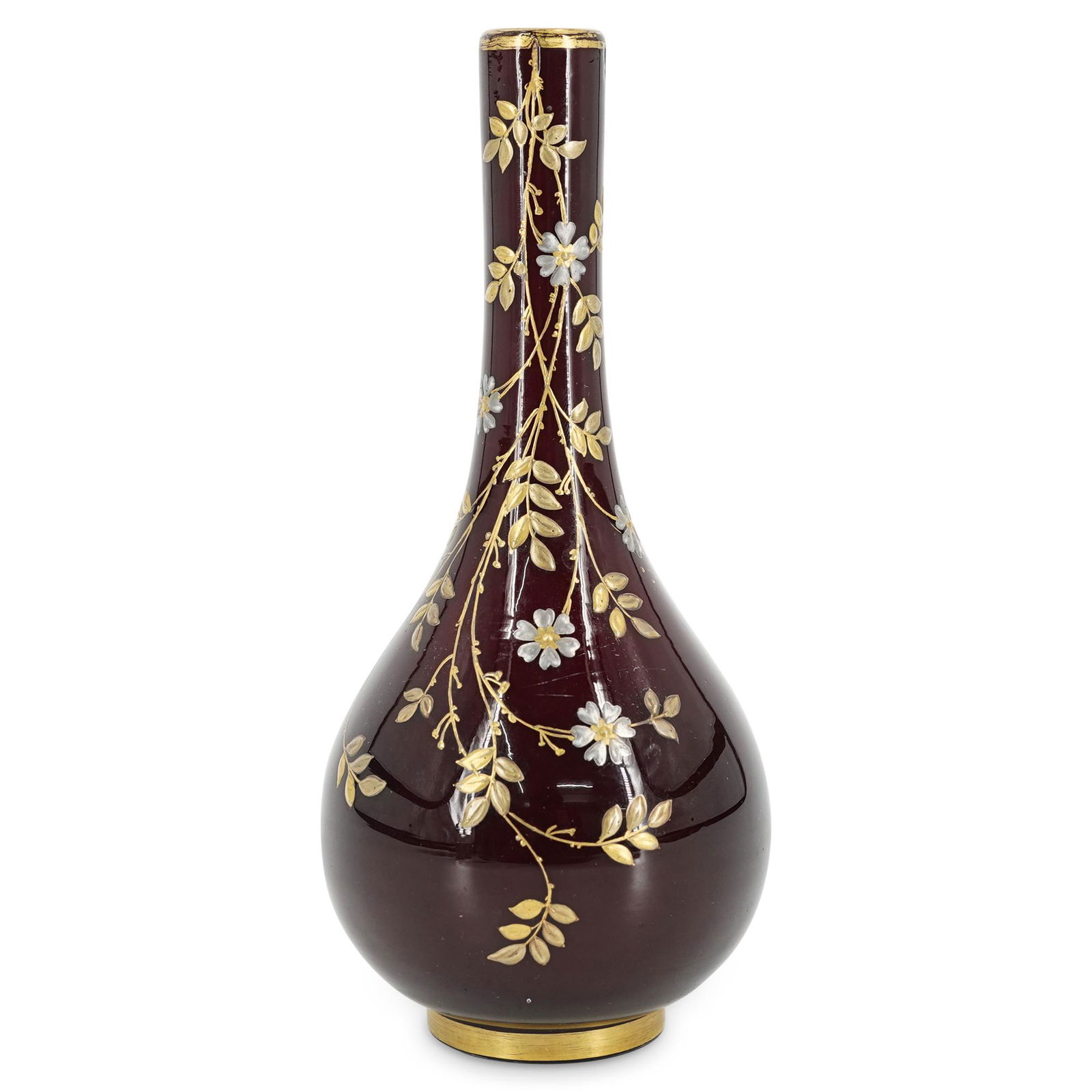 Probably Thomas Webb And Sons Pigeon Blood Vase: DESCRIPTION: Possibly Webb and Sons pigeon blood vase featuring an enameled floral design embellished with gilt foliage designs. Finished with a gilt lip and foot. CIRCA: 20th Century ORIGIN: England