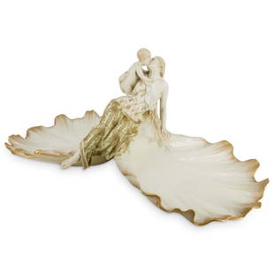 Monumental KPM Porcelain Centerpiece: DESCRIPTION: Monumental KPM centerpiece featuring a seashell form bowl on either side flanking a reclining woman holding and kissing her child. Piece is embellished with gilt accents on women's