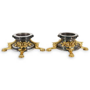 Pair of Christofle Silvered and Gilt Bronze Bases: DESCRIPTION: A pair of Christofle bronze bases feature in silvered and gilt tones, decorated along the body with floral motif banners applications and sustained by four griffin legs. Stamped along the