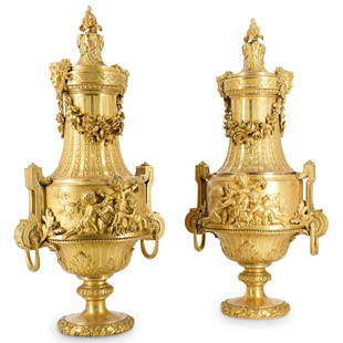 Ex-Christies Pair of Napoleon III Ormolu Vases & Fixed Covers: DESCRIPTION: Ex-Christies pair of large Napoleon III ormolu vases each with spirally gadrooned neck flanked by female masks and linked by suspended floral swags, the body cast in high relief with