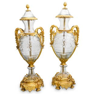 Monumental Crystal Mounted Dore Bronze Urns: DESCRIPTION: A pair of monumental French crystal mounted dore bronze urns with double acanthus leaf formed handles, ornate folate trims and fluted crystal body, raised on finley cast ribbon and