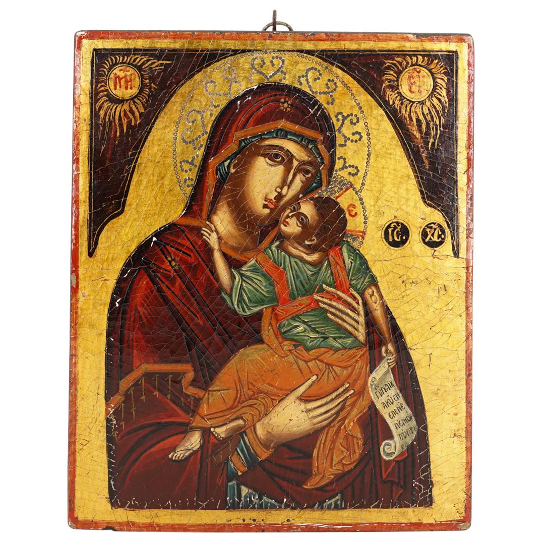 Antique Russian Icon, Mother of God: DESCRIPTION: An antique Russian icon featuring the depiction of (The Mother of God) composed of polychrome wood with tempera details. CIRCA: Early 20th Cent. ORIGIN: Russia DIMENSIONS: H: 14" x L: 11.