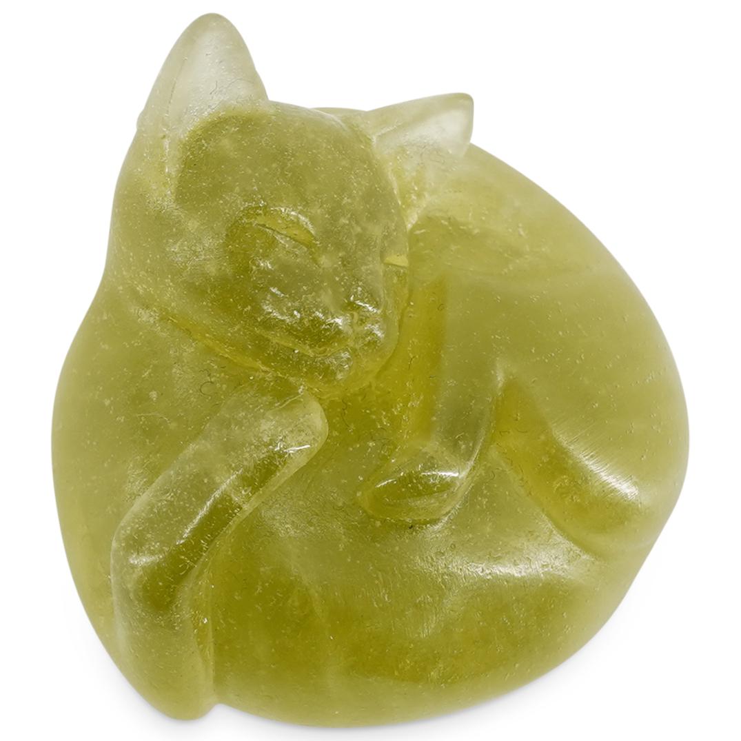 Daum Crystal Cat Figurine: DESCRIPTION: Daum lime green crystal figurine of a cat lying on its back wearing a slight smile. Etched signature at the underside "Daum". CIRCA: 20th Century ORIGIN: France DIMENSIONS: H: 1.37" X W: