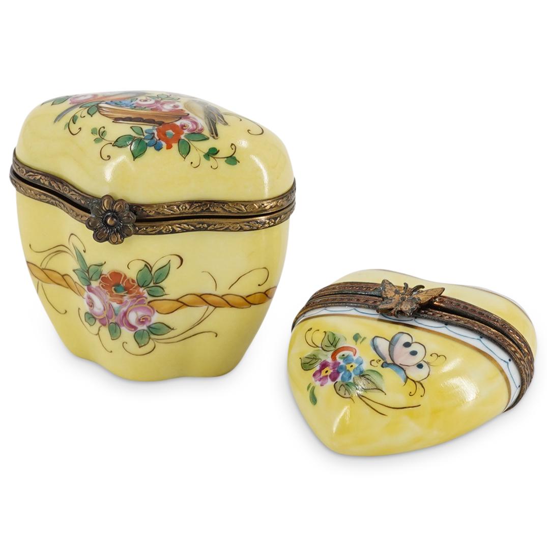 (2 Pc) Limoges Hand Painted Hinged Lidded Pill Boxes: DESCRIPTION: Two hinged lid Limoges pill boxes, each featuring hand-painted floral motifs and yellow backgrounds. One is heart-shaped and marked "I LOVE YOU" in gilt lettering inside body; the other i