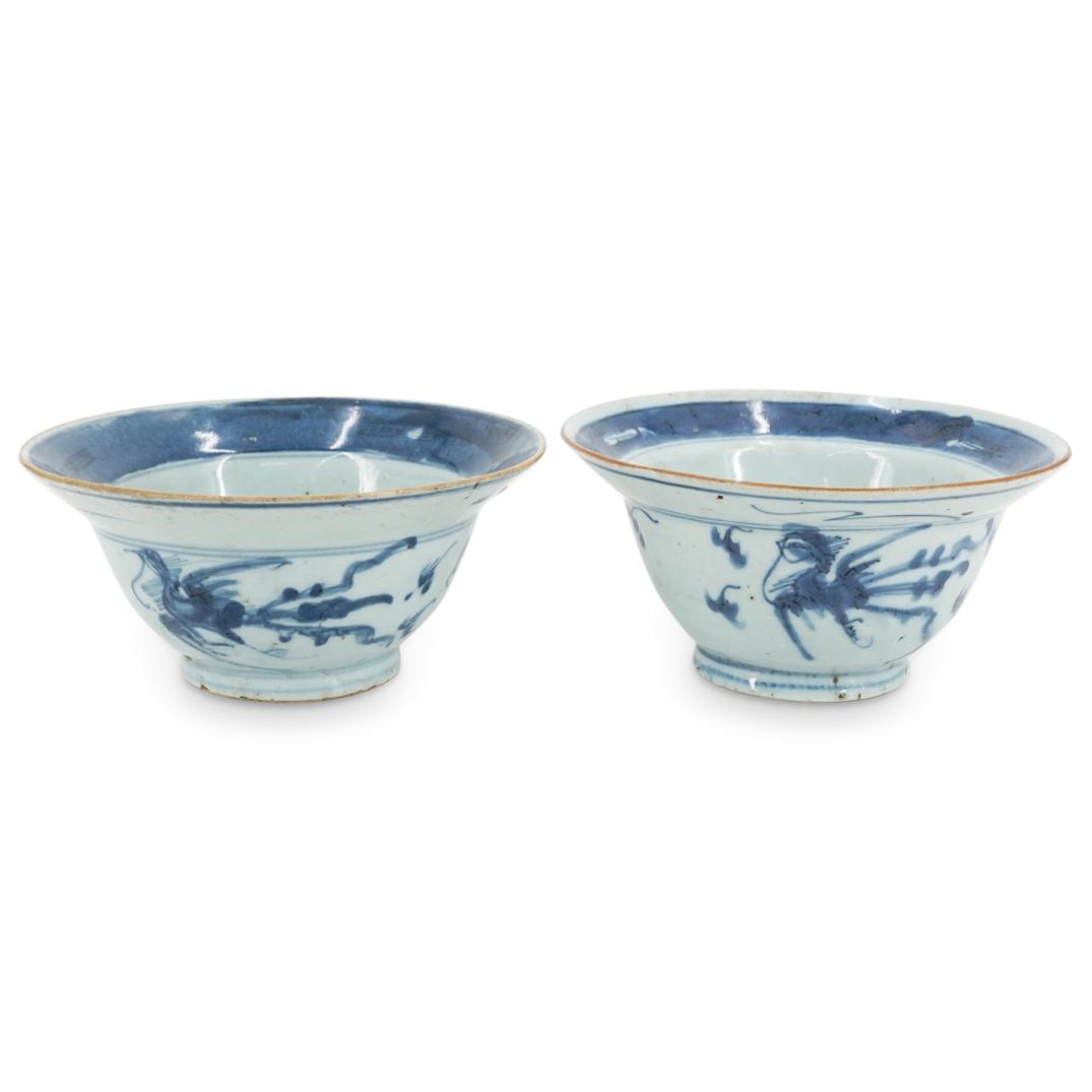 Pair Of Antique Chinese Blue And White Dragon Ogee Bowls: DESCRIPTION: Two antique blue and white bowls, each featuring an ogee design and decorated on the side with dragon motifs. Each bowl is embellished in the well with a Han character and abstract shapes