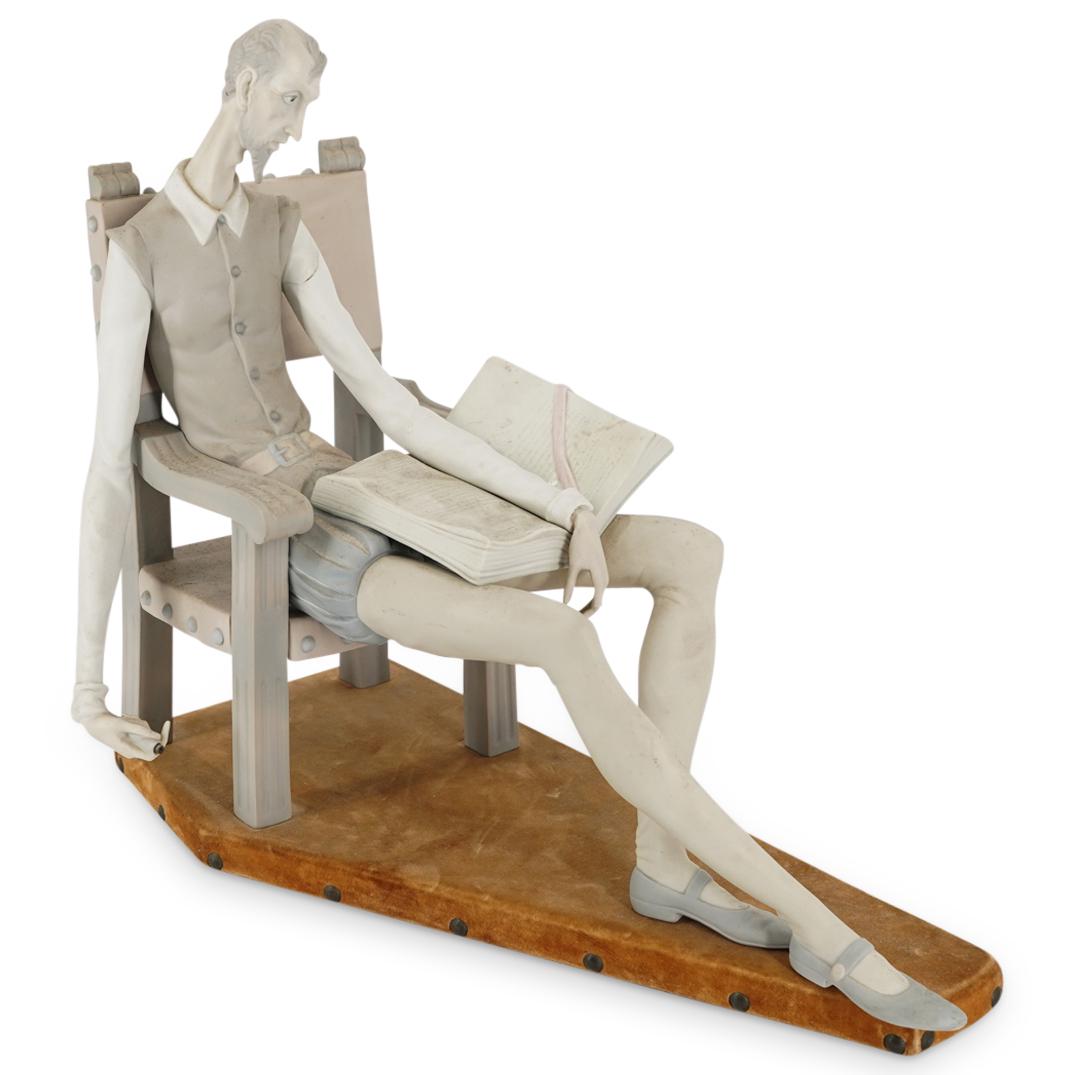 Lladro "Don Quixote" Porcelain Statue: DESCRIPTION: A Lladro unglazed porcelain statue. Titled: "Don Quixote" features Don Quixote character sitting reading with a sword in hand. Marked on bottom "Lladro, Made In Spain" rests on a felt wra