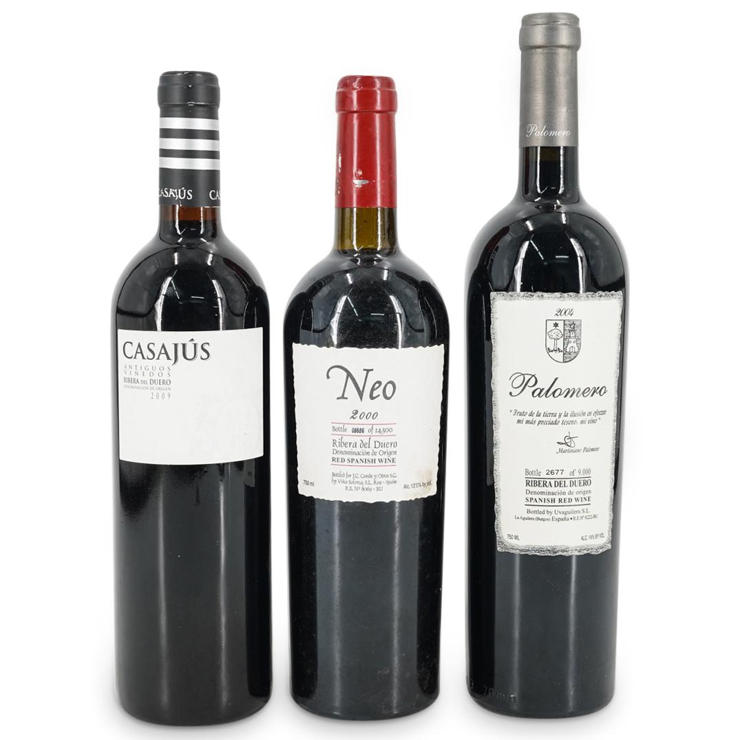 (3 Pc) Spanish Ribera Del Duero Red Wine Bottles: DESCRIPTION: (3 Pc) Three Spanish Ribera Del Duero red wine bottles. This lot includes: one (1) 2000 Neo red wine bottle; one (1) 2009 CasaJus Tempranillo wine bottle; and one (1) 2004 Palomero red wi