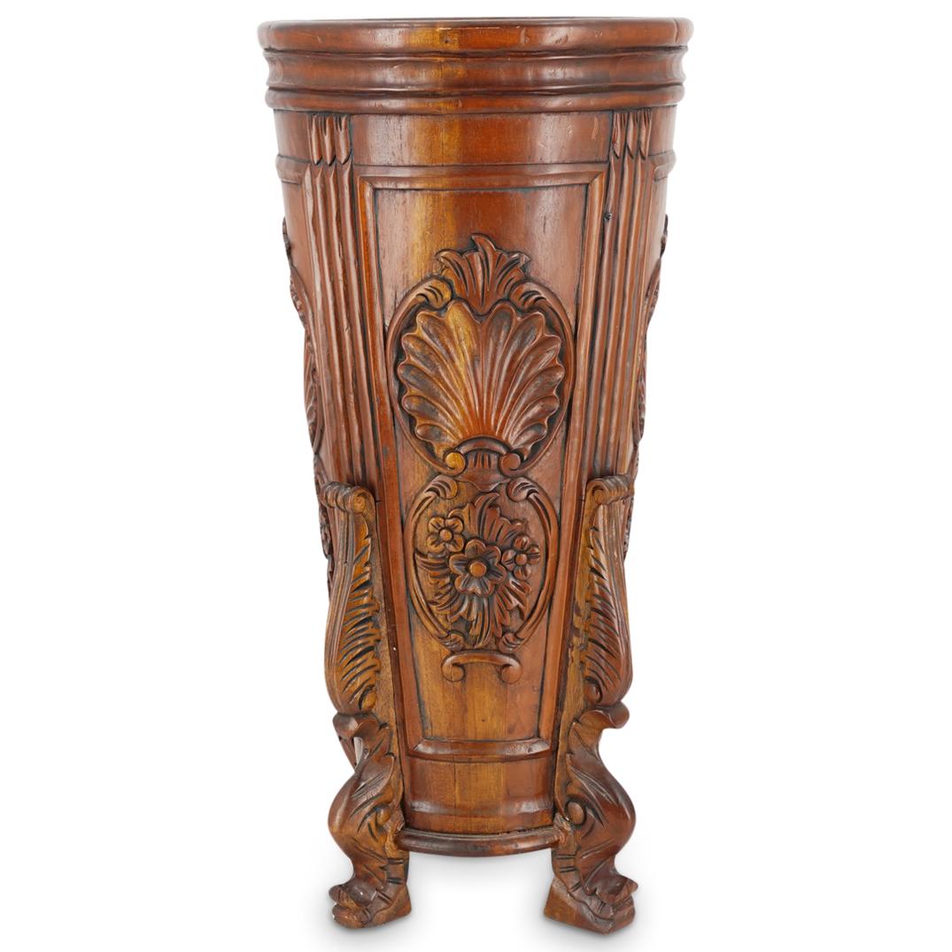 Vintage Carved Wood Footed Floral Umbrella Stand: DESCRIPTION: Vintage carved wood umbrella stand featuring four feet with foliage depictions in relief throughout as well as flowers depictions in relief inside bevel cut borders. CIRCA: 20th Century O