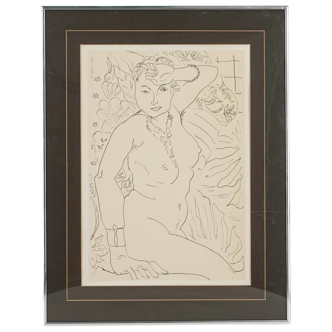 Henri Matisse Nude Portrait Print on Paper: DESCRIPTION: Print on paper drawing by French artist Henri Matisse (1869-1954); Depicting a prone nude woman on flowers with other foliage details. Mounted in chrome toned metal frame with black matti