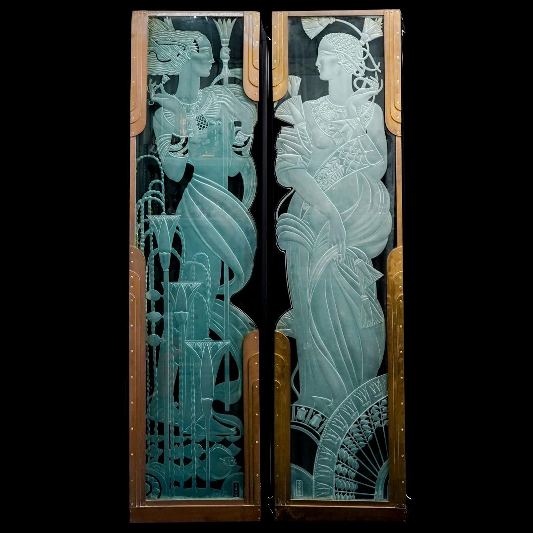 Monumental Dennis Abbe Art Deco Revival Glass and Bronze Doors: DESCRIPTION: A pair of Monumental Art Deco Revival doors/panels comprised of frosted and clear glass depicting Egyptian woman elegantly dressed, complemented with scarab accents. Further fitted along