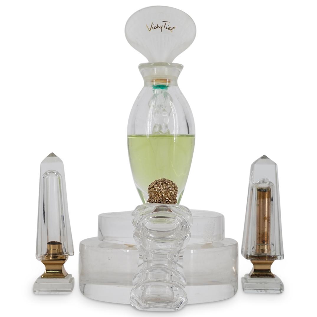 (4 Pc) Vicky Tiel Perfume & Christian Dior Lipstick Cases: DESCRIPTION: (4 Pc) A Vicky Tiel Perfume and Christian Dior lipstick cases grouping set. This set includes: one (1) Vicky Tiel "Ethere" perfume; two (2) Christian Dior lipstick cases; and one (1) smal