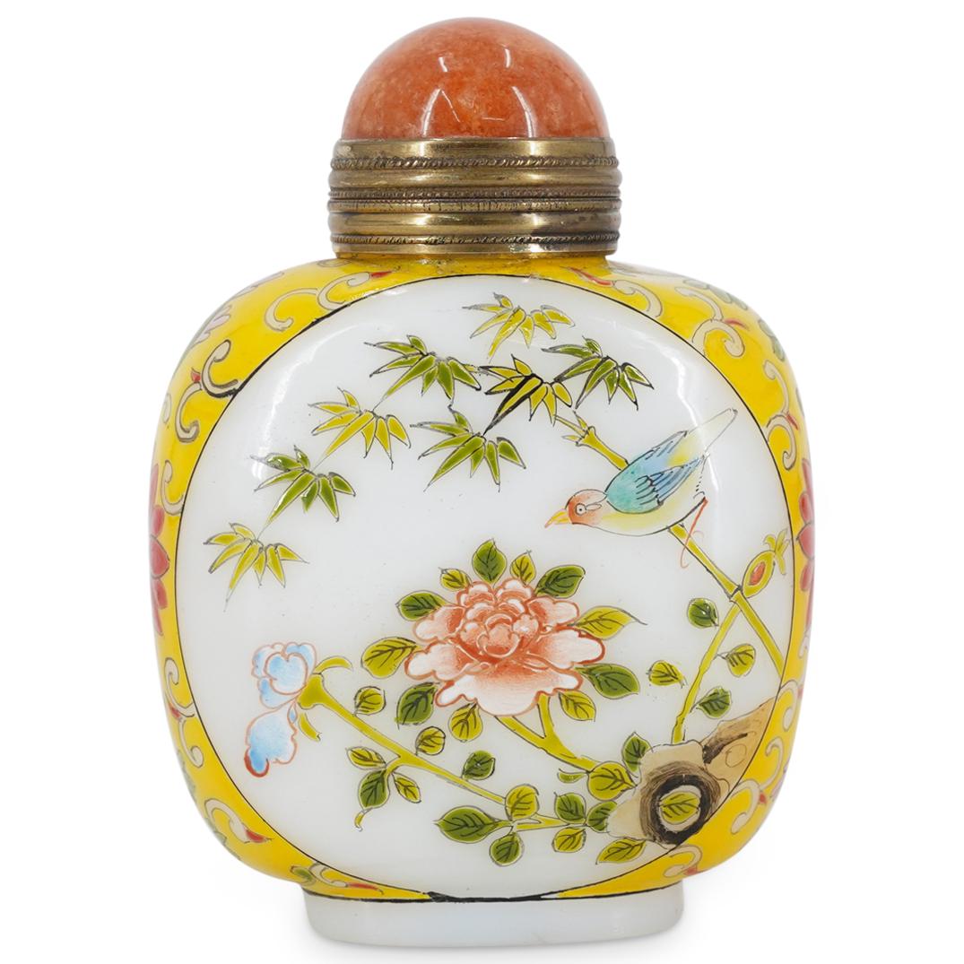 Antique Chinese Enameled Glass Snuff Bottle: DESCRIPTION: An antique Chinese glass snuff bottle with yellow and white composition decorated with vibrant floral and bird motifs, completed with a polished coral, metal capped stopper. Character mar