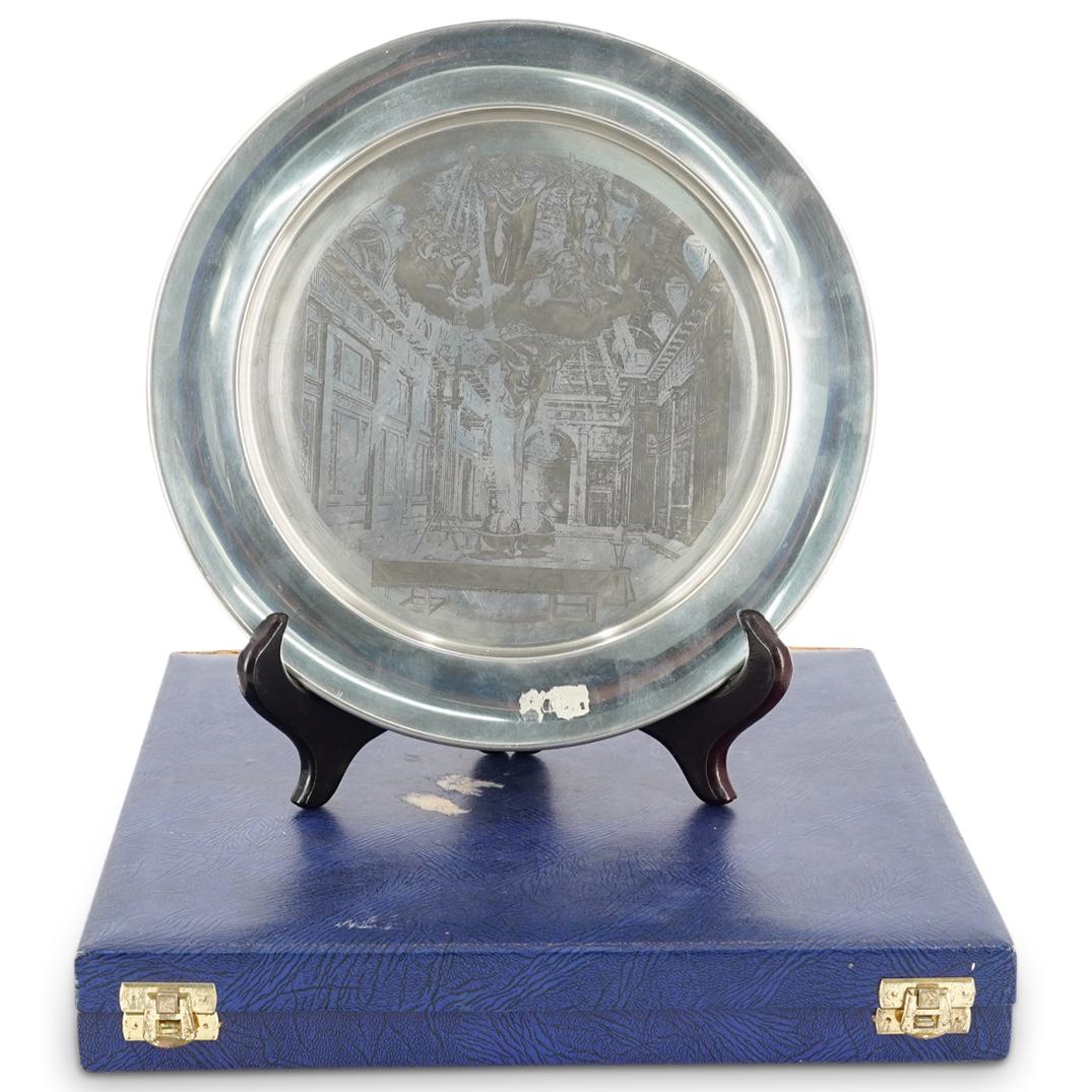 Toye Kenning & Spencer Engraved Pewter Masonic Plate: DESCRIPTION: An english Masonic Plate decorated with Masonic symbolism depicting a reproduction of the 1784 Book of Constitutions of the first Freemason Hall, Great Queen Street in London. Drawn by Gi