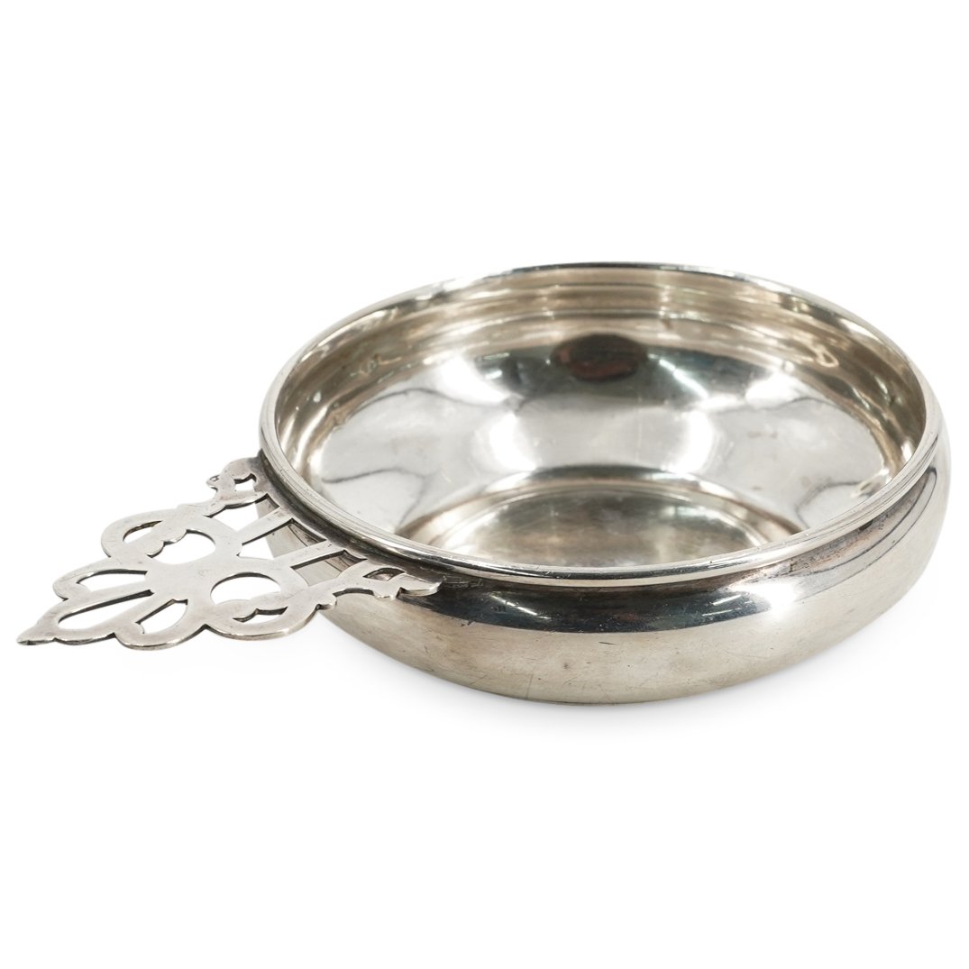 Gorham Sterling Silver Porringer: DESCRIPTION: Gorham Sterling silver porringer featuring a open work handle. Stamped at the underside of the handle with hallmarks "Gorham Sterling 700" as well as a lion, an anchor, and a "G". Total W