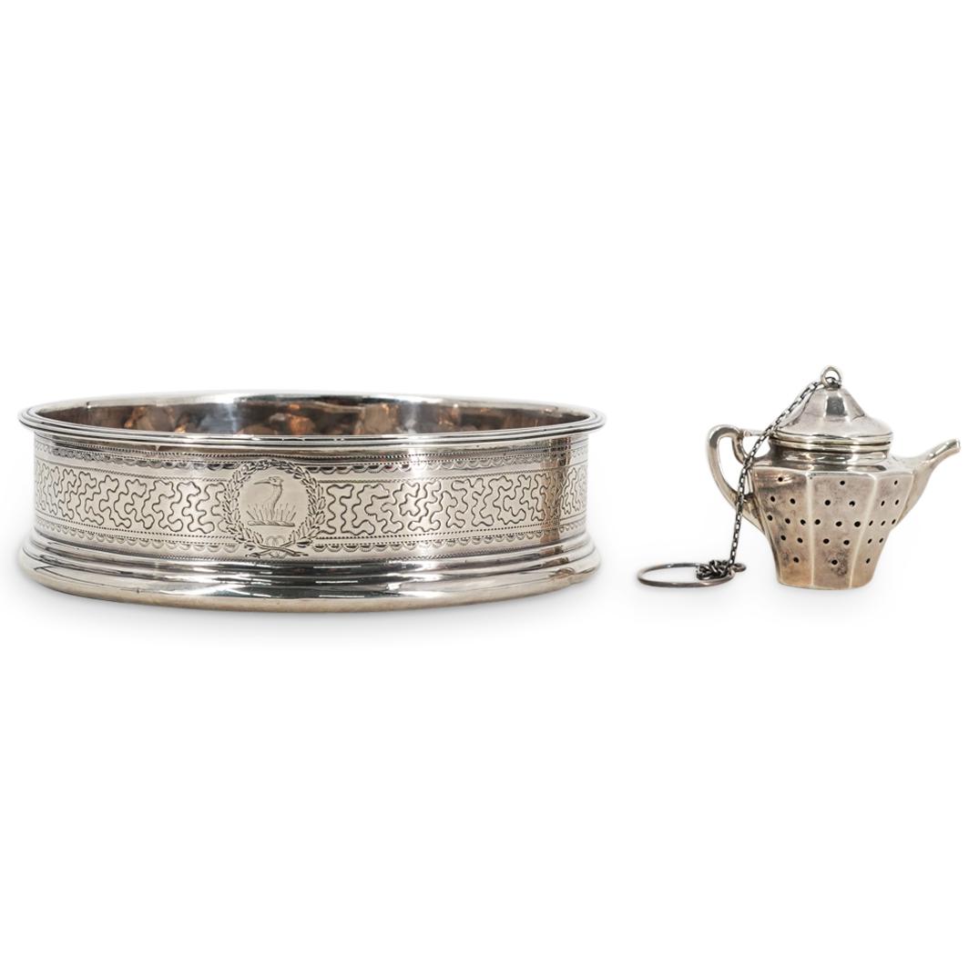 (2Pc) Antique Sterling Silver Wine Coaster & Tea Infuser: DESCRIPTION: (2Pc) Antique Sterling silver wine coaster and tea infuser. (1) Pitcher form tea infuser featuring a hinged lid, pierced body, chain with ring attached to the top, and spout. Stamped part
