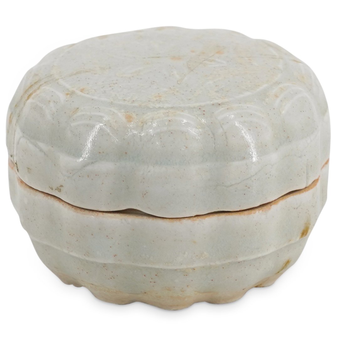 Antique Vietnamese Hoi An Shipwreck Porcelain Box: DESCRIPTION: Ceramic scallop lipped lidded box from the Hoi An shipwreck decorated with a six-petal floral motif on the lid. CIRCA: 16th Century, possibly older ORIGIN: Vietnam DIMENSIONS: H: 1.75" W: