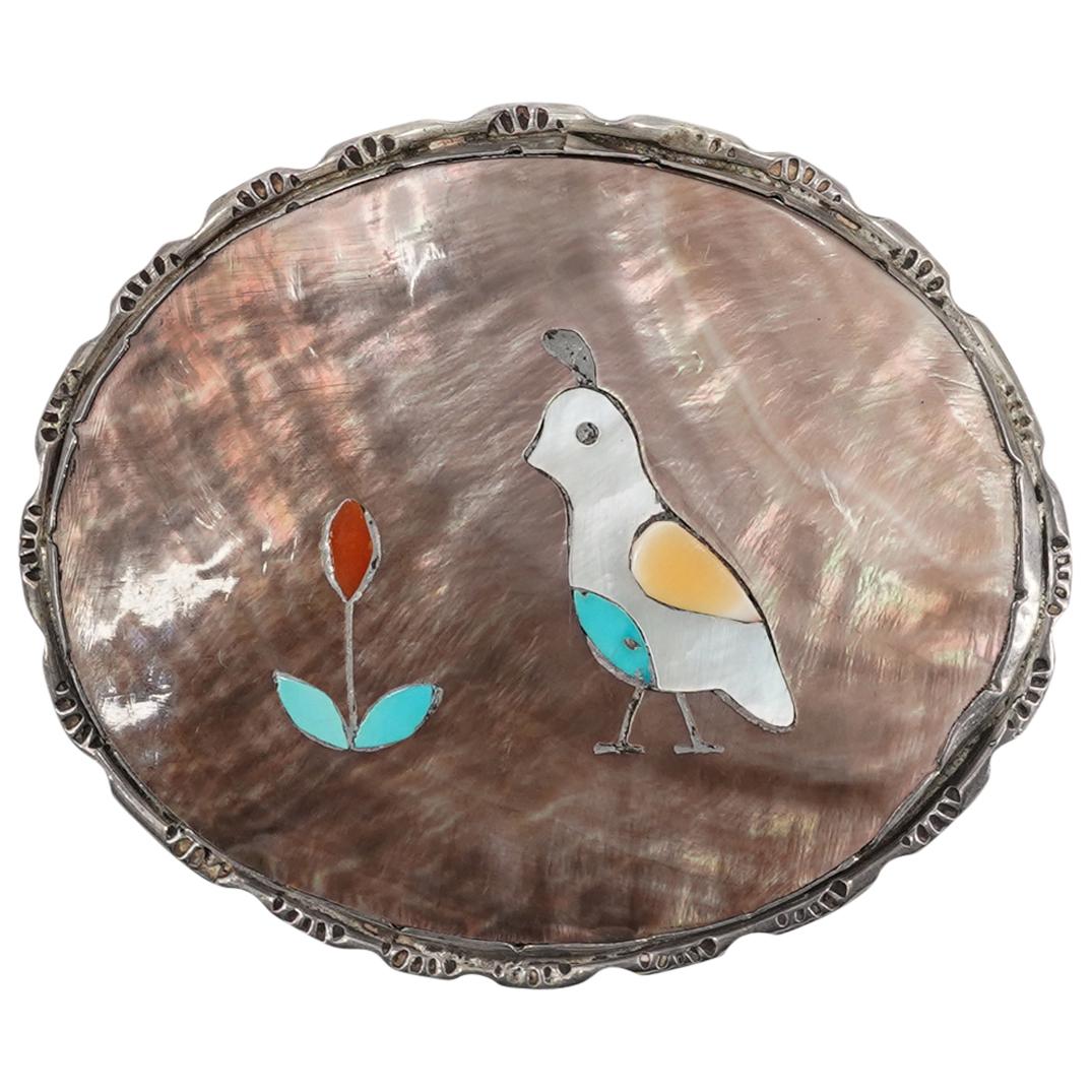 R. Qualo Native American Sterling Turquoise & Abalone Bird Belt Buckle: DESCRIPTION: R. Qualo Zuni Native American Sterling silver belt buckle inset by abalone and centered by bird and flower inset depiction composed of turquoise and semi-precious stones. Signed at the ba