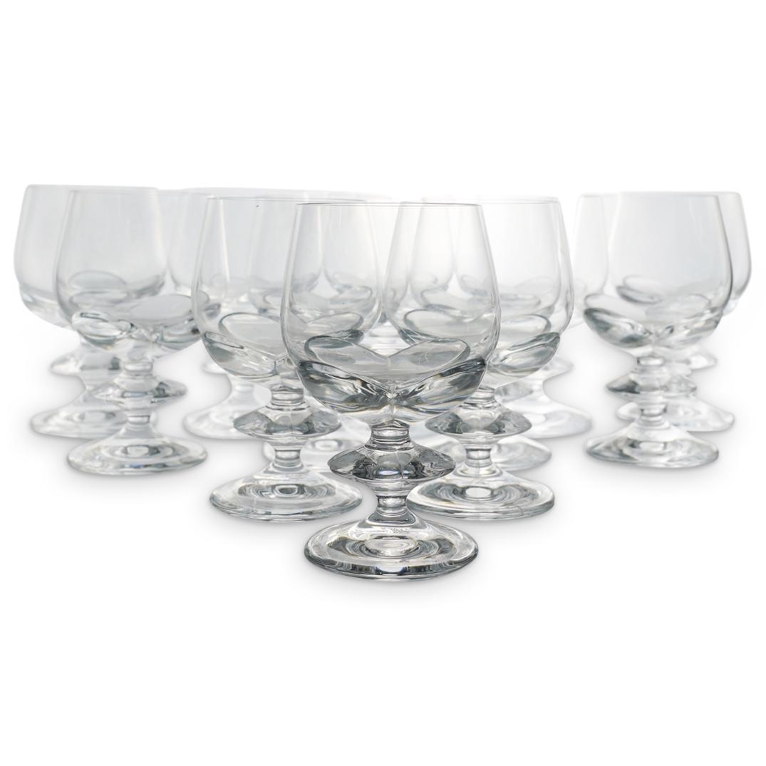 (12 Pc) Lalique Crystal "Blois" Wine Glasses Set: DESCRIPTION: (12 Pc) A Lalique crystal wine glasses stemware set. Includes twelve glasses, in clear crystal by Lalique, in the pattern "Blois", decorated with a flower motif on the goblet and the ring
