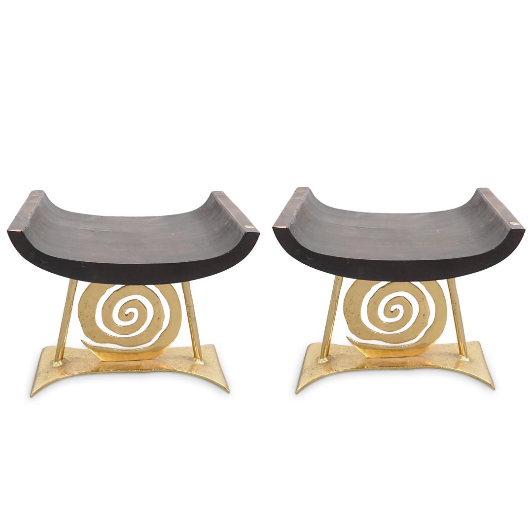 David Marshall Disenos Designer Gilt Metal & Wood Stools: DESCRIPTION: Pair of David Marshall Disenos designer gold toned metal and wood stools. Signed at plaque. CIRCA: 20th Cent. ORIGIN: Spain DIMENSIONS: H: 17" x W: 20" x L: 13.5" CONDITION: Great conditi