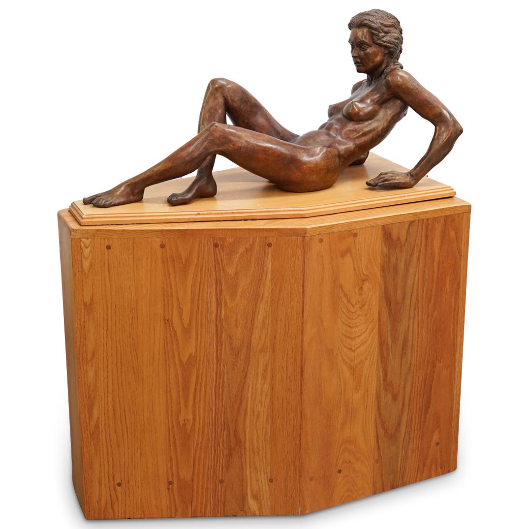 Michael Shacham (B. 1938) "Power Of Tyranny 5/6" Bronze Sculpture: DESCRIPTION: Bronze sculpture entitled "Power of Tyranny 5/6" by Michael Shacham depicting a nude, reclining woman. Signed "M. Shacham" and numbered 2 of 25 on left buttock, and mounted on a wooden ba