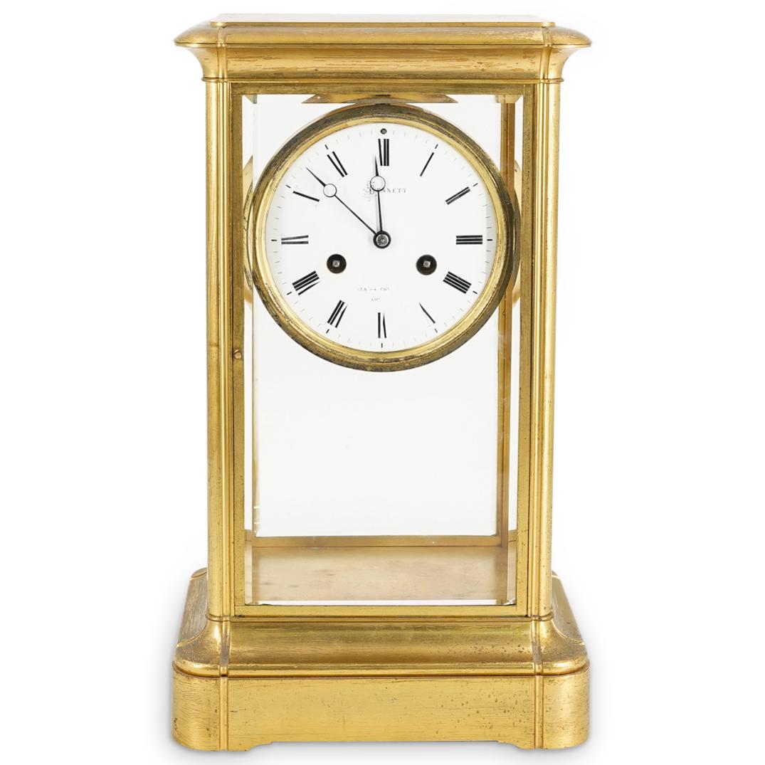 Sir John Bennett Mercury Pendulum & Bronze Mantel Clock: DESCRIPTION: Antique Sir John Bennet bronze mantel clock featuring a crystal regulator, compensated mercury pendulum, footed bronze base and case with windows and hinged door. CIRCA: Early 20th Centur