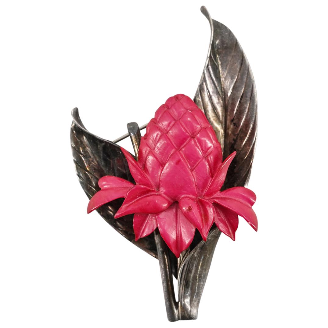 Antique Mings Sterling Silver and Painted Bone Brooch: DESCRIPTION: An Antique Sterling silver Brooch from Ming's Honolulu, Hawaii. The brooch featuring a leaf form centered by painted carved bone fruit. Stamped along the back "Ming's Sterling". Total Wei