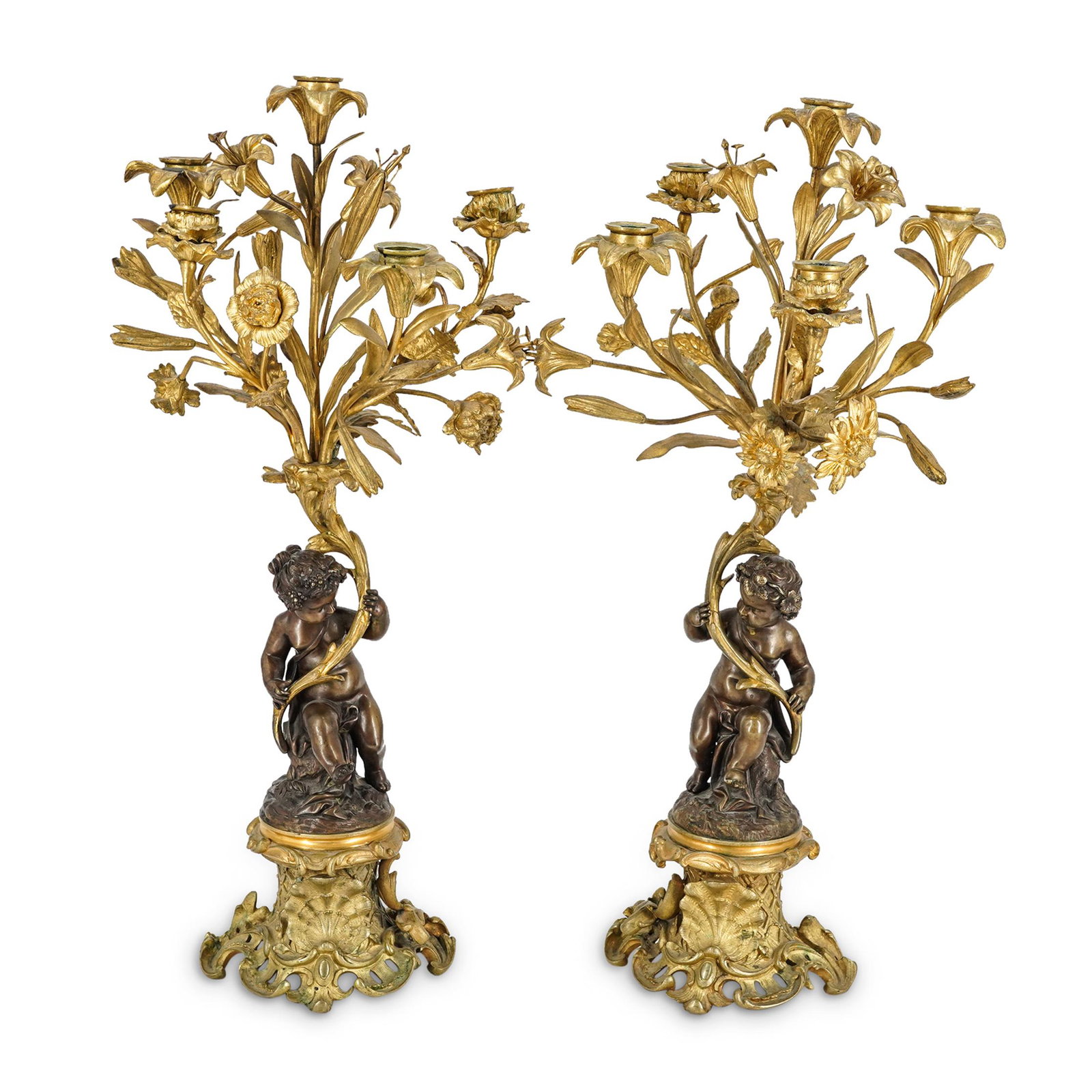 Pair of French 19th Century Bronze Candelabras: DESCRIPTION: Pair of matching bronze candelabras, each featuring a central figure of a child crowned with grapevines and holding a large piece of foliage out of which springs five elaborately fashione