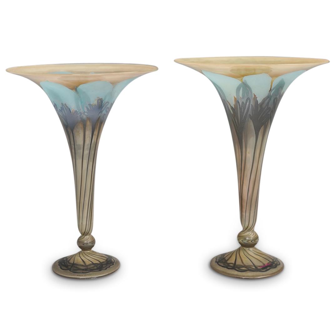 Pair of Vera Walther Art Glass Vases: DESCRIPTION: A pair of Art Glass vases by German maker Vera Walther, features a trumpet form with silver pulled floral motif on turned decorated foot. Acid etched signature on foot and stickered. CIRC