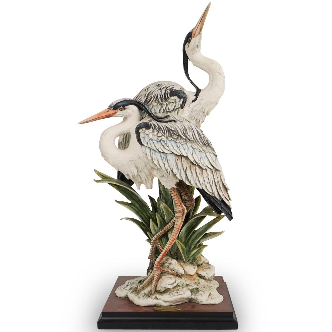 Giuseppe Armani "Elegance In Nature" Figurine: DESCRIPTION: Giuseppe Armani "Elegance In Nature" Resin figurine featuring a pair of herons mounted to base with plaque. Signed "Giuseppe Armani" CIRCA:20th Ct. ORIGIN:Italy DIMENSIONS:H:23.75" x L:10