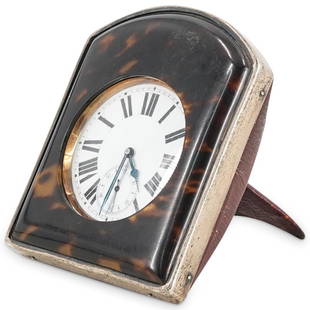 Antique English Sterling Silver Travel Clock Case W/ Pocket Watch: DESCRIPTION: Argentan pocket watch in a Charles & Richard Comyns sterling silver framed, silk padded travel case with a tortoiseshell-like front cover and a leather backing with stand. Watch is tested