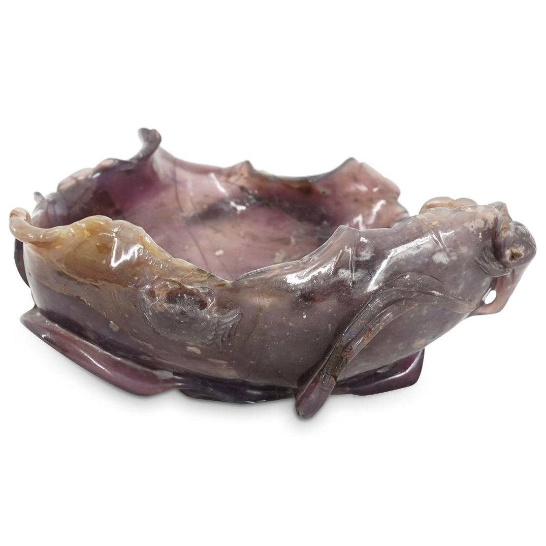 Chinese Carved Amethyst Leaf Brush Pot: DESCRIPTION: A Chinese carved amethyst brush pot, carved with the shape of a water Lily leaf; further adorned with high relief floral stems entwined around as to create a base support, and with an add