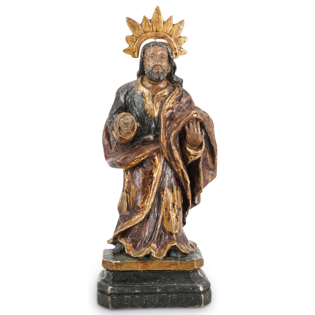 Antique St. Joseph Gessoed Gilt Carved Wood Sculpture: DESCRIPTION: Antique gessoed carved wood sculpture of St. Joseph lacquered throughout, presenting red and black toned robes with gilt details, flesh tones at the face and hands with a gilt halo mounte