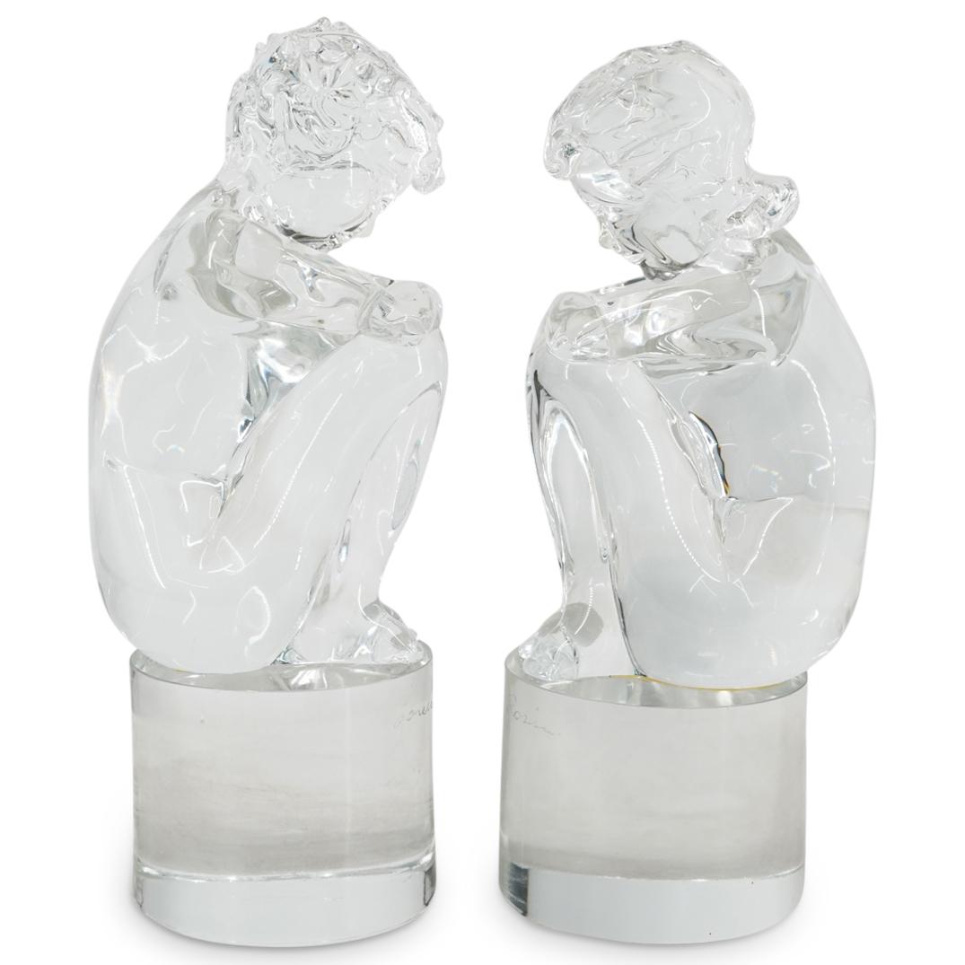 Pair of Loredano Rosin (Italian, 1936-1991) "Crouching Nude" Figural Glass Sculptures: DESCRIPTION: Pair of Loredano Rosin (Italian, 1936-1991) Clear glass blown statues depicting nude male and female figures in crouching positions atop cylindrical bases. Each incised with signature: "L